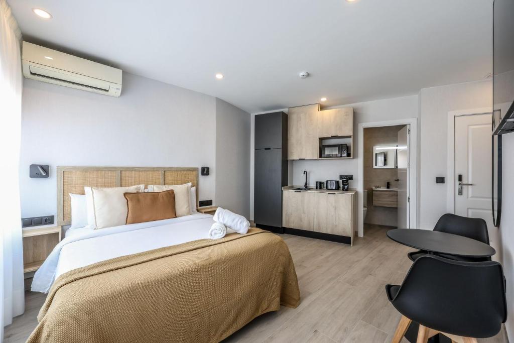 a bedroom with a large bed and a desk at Password to Malasaña in Madrid