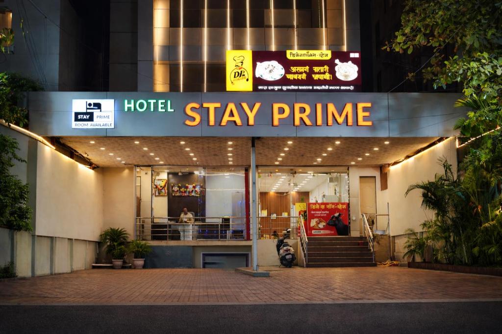 a hotel with a sign that reads stay prime at Stay Prime, Balewadi in Pune
