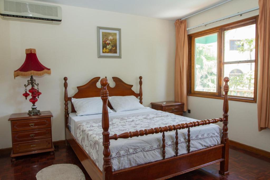 Postel nebo postele na pokoji v ubytování Arla Residential