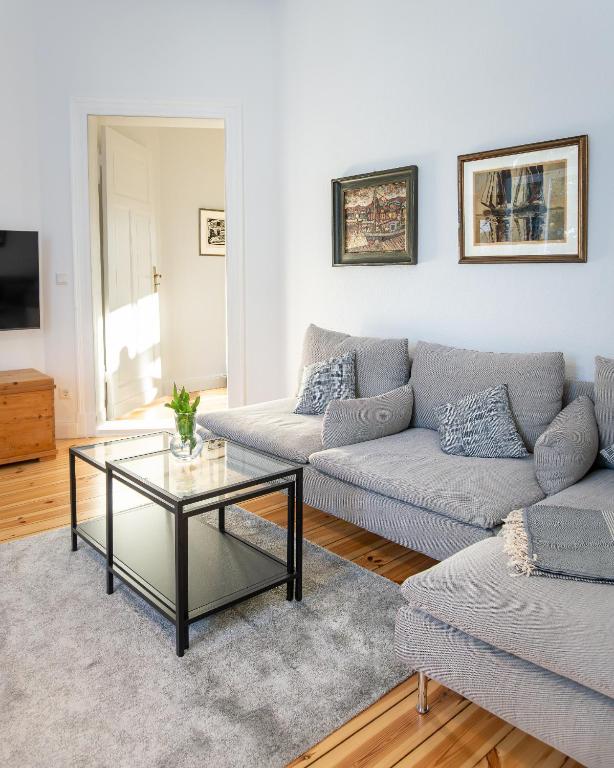 a living room with two couches and a coffee table at Villa Cremona in Bansin