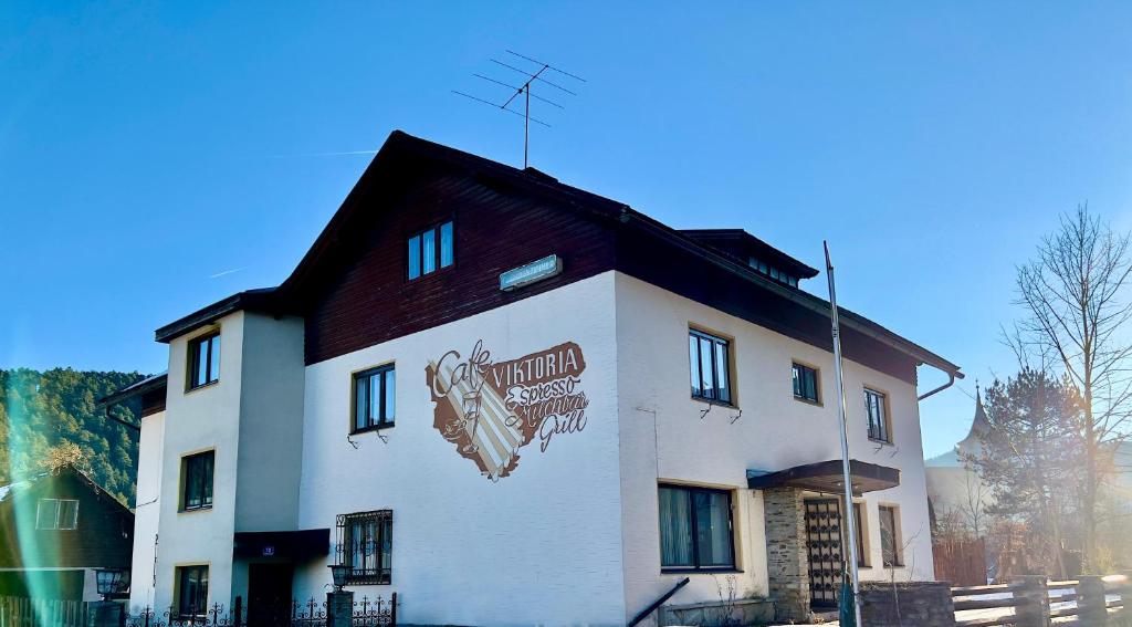 a building with a sign on the side of it at Alpenresidenz Viktoria in Türnitz