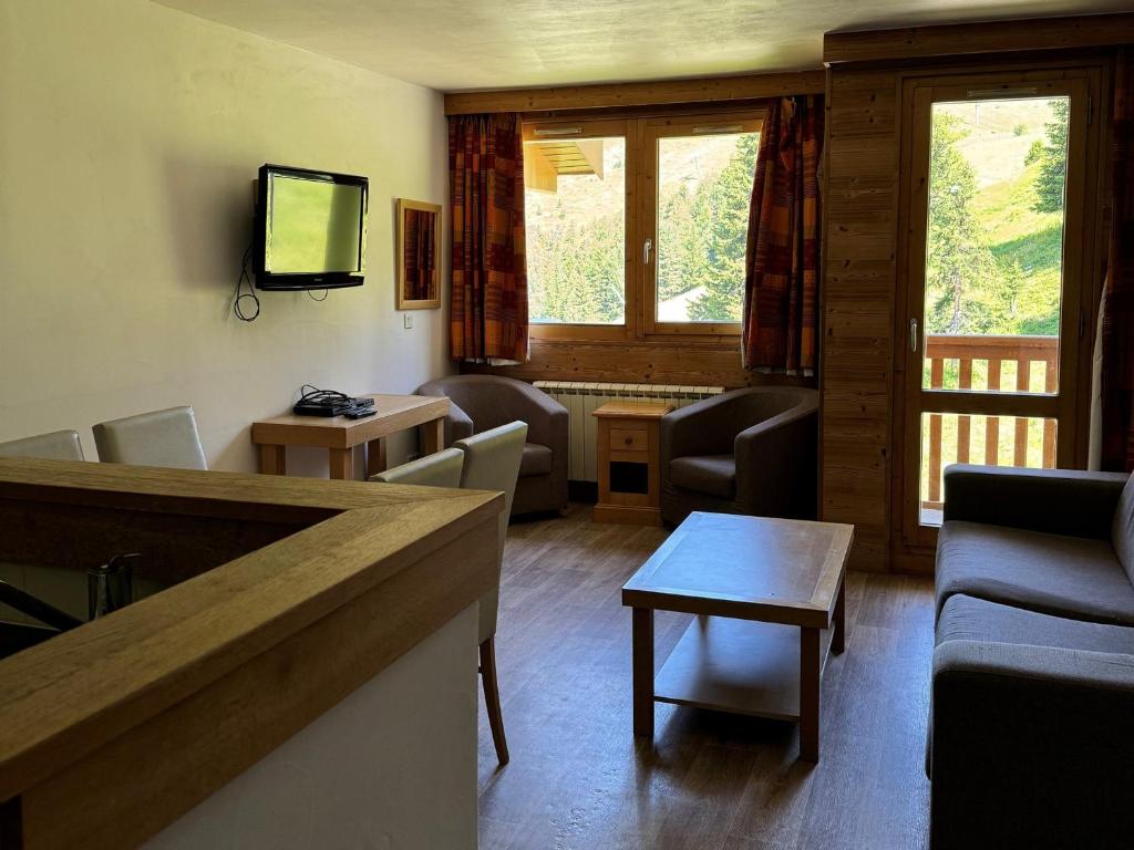 Appartement cosy avec accès direct aux pistes, espace bien-être et piscine chauffée