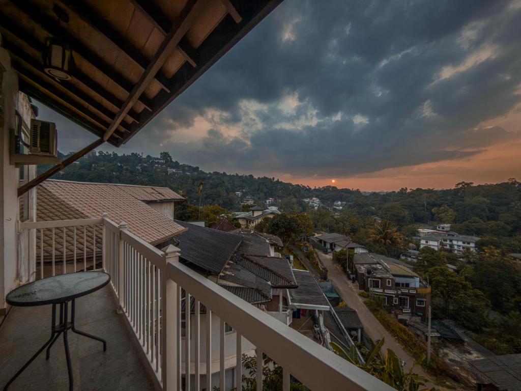 a balcony of a house with a view of a town at Nature Breeze Boutique Villa in Kandy