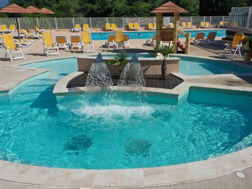 a pool with a fountain in the middle at Camping Parc Bellevue - Maeva in Cannes