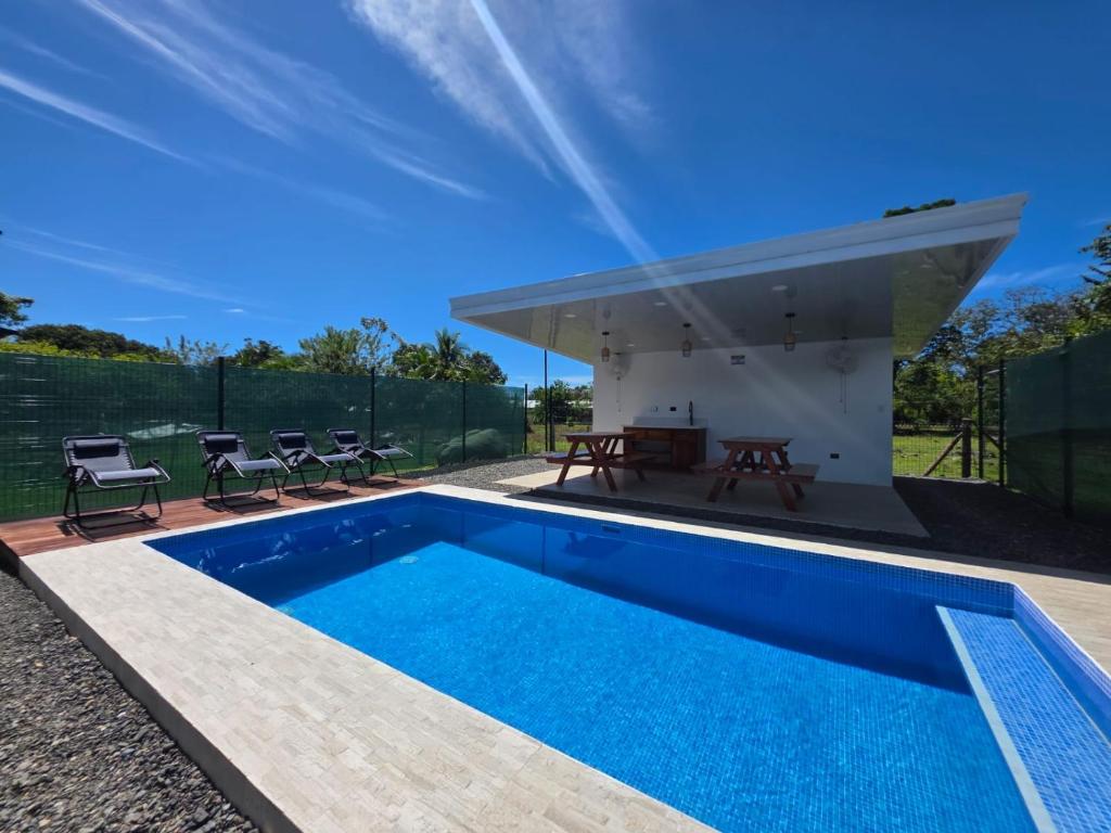 an image of a swimming pool in a house at Ocean Breeze at Life's a Beach in Uvita