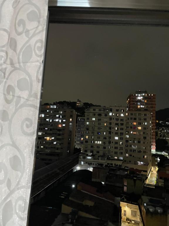 a view of a city at night from a window at Lapaturismo in Rio de Janeiro