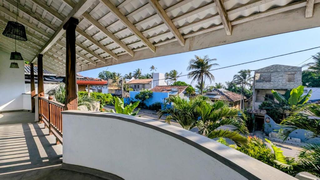 a view from the balcony of a house at South Roots in Unawatuna