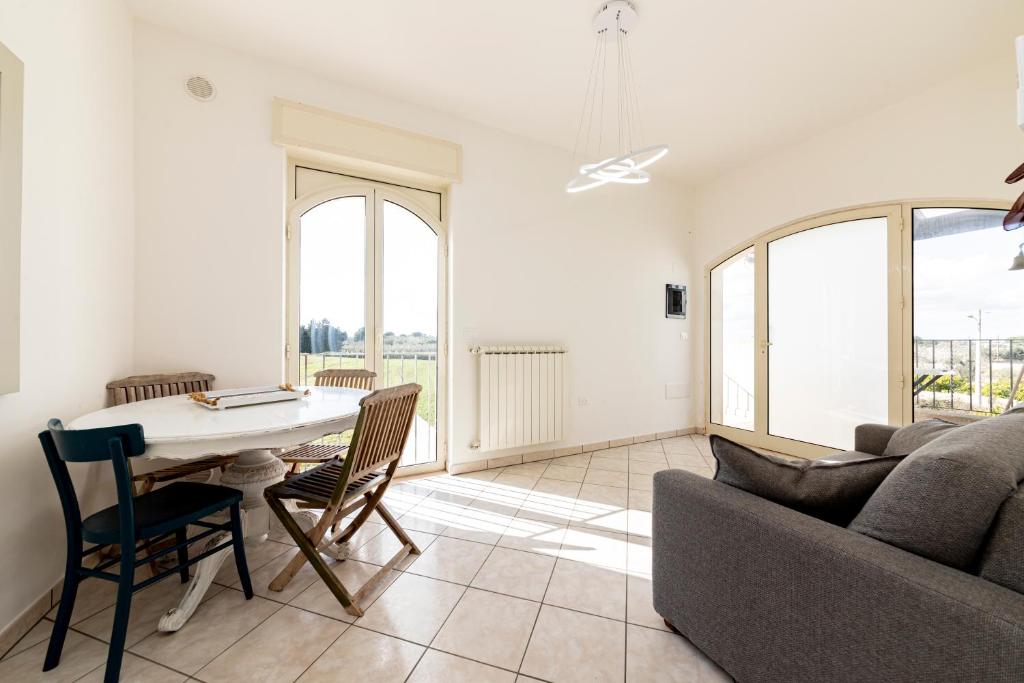 a living room with a couch and a table at Blue Dreams - Marittima in Marittima