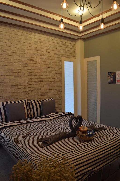 Postel nebo postele na pokoji v ubytování I-Talay Loft