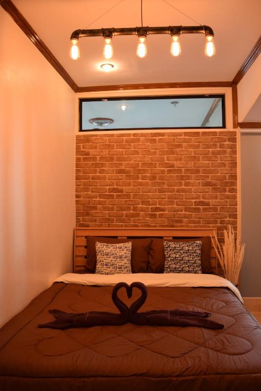 Postel nebo postele na pokoji v ubytování I-Talay Loft