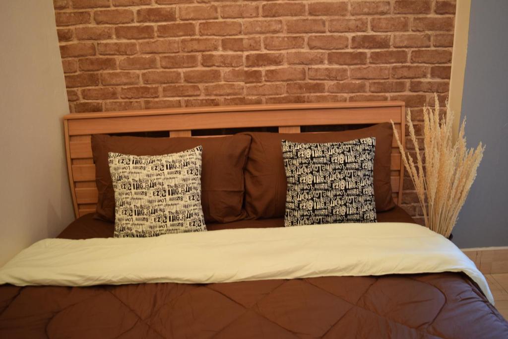 Postel nebo postele na pokoji v ubytování I-Talay Loft