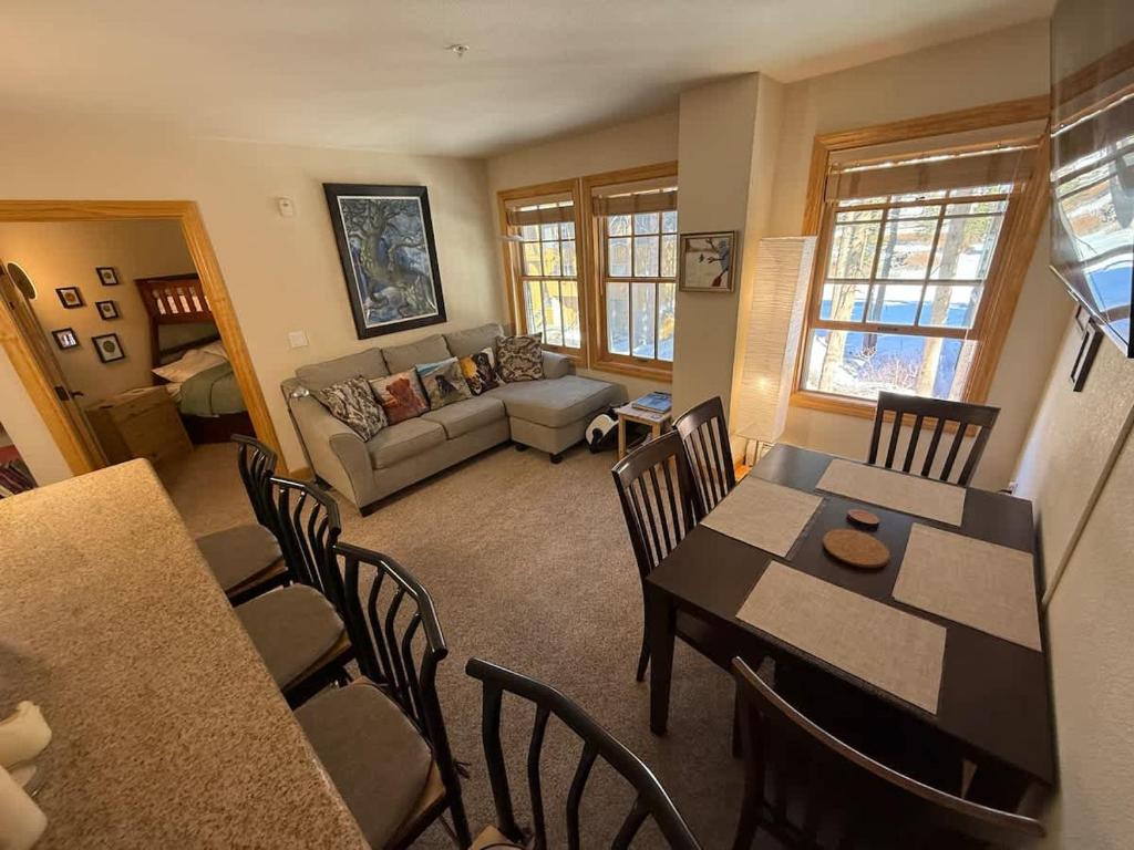 a living room with a table and chairs and a couch at Family Ski Getaway in Kirkwood