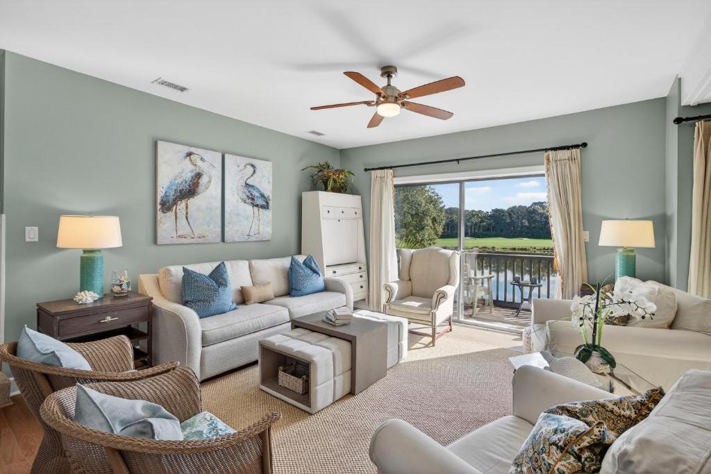 a living room with a couch and chairs at 4922 Turtle Point in Kiawah Island