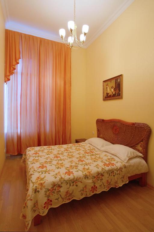 Postel nebo postele na pokoji v ubytování Ekaterina Hotel