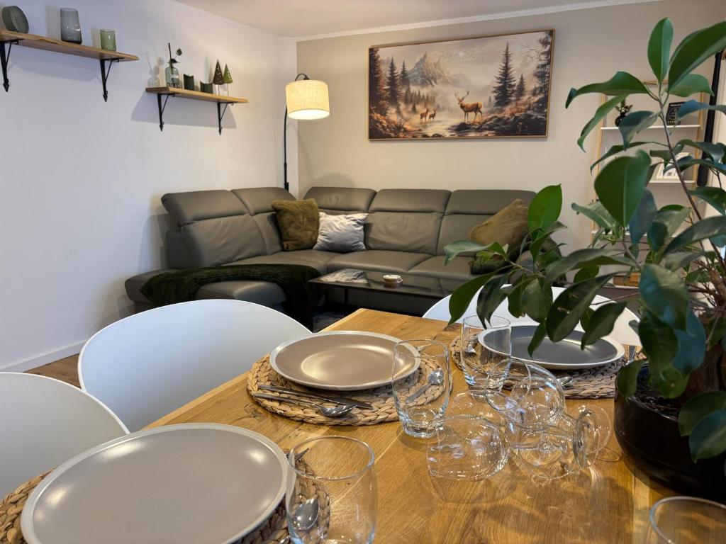a living room with a table and a couch at Apartment am Grimmsteig in Nieste
