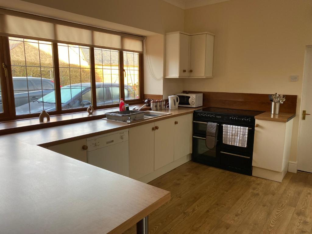 a kitchen with a sink and a stove at Oldcotes Studio in Firbeck