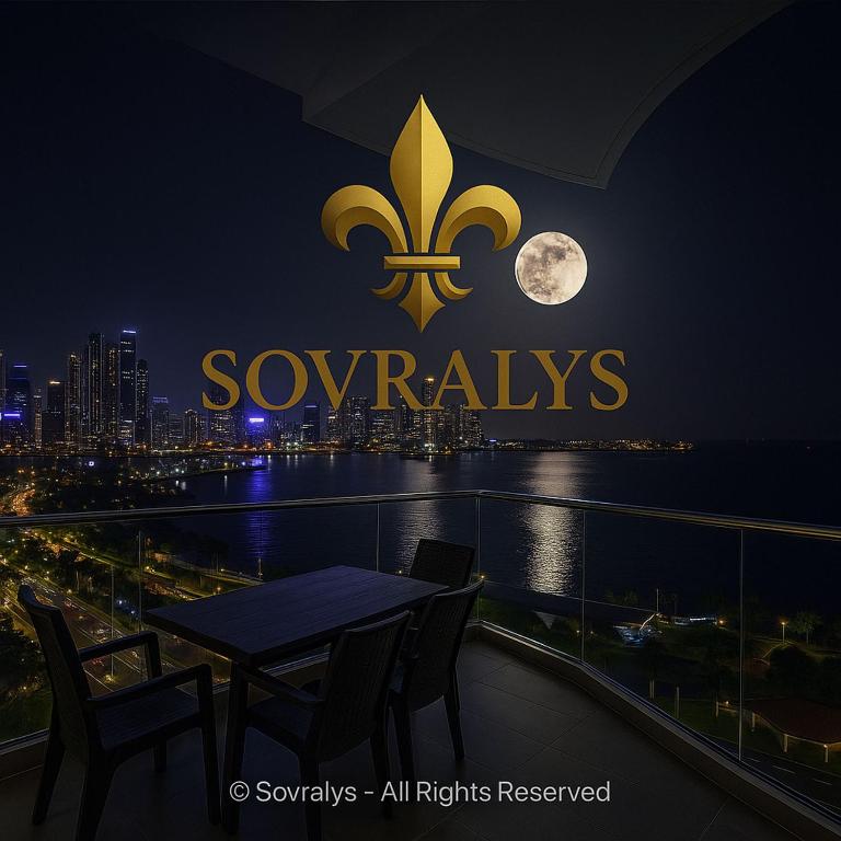 a table and chairs on a balcony at night with the moon at 80M Luxury Ocean View Apartment PH The Sands, Next to Hilton in Panama City
