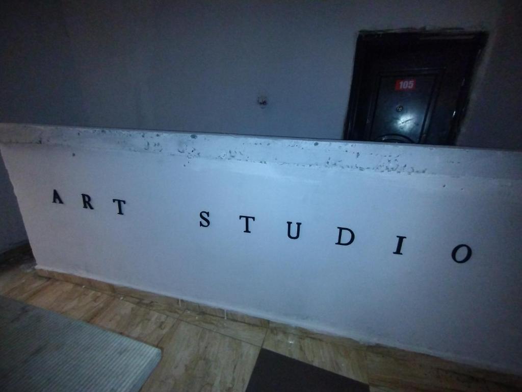an art studio sign on a wall in a room at Classic Hotel by TWM in Ibadan
