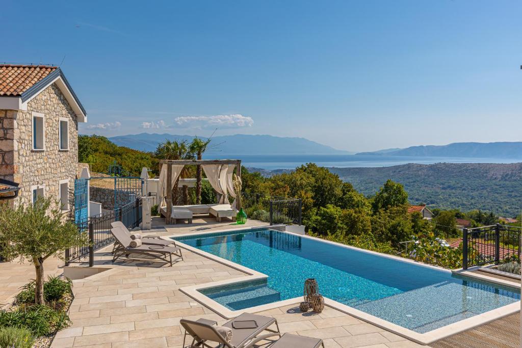 a villa with a swimming pool with a view at Villa 72 Crikvenica Riviera in Bribir