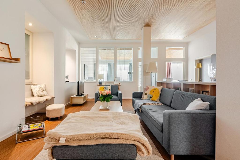 a living room with a couch and a table at Antonius Art-Loft in Waldshut-Tiengen