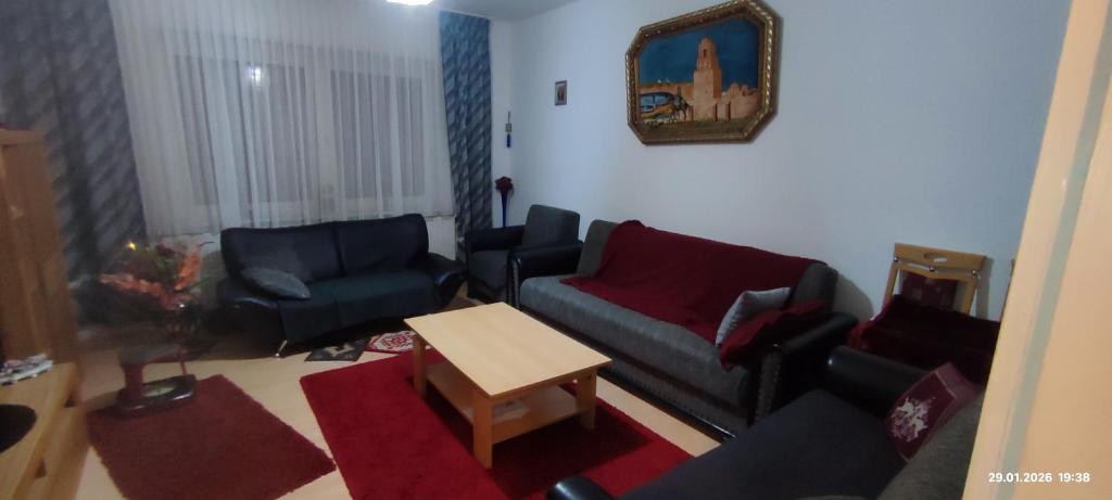 a living room with a couch and chairs and a table at Wohnung in der Ruhr Witten in Witten