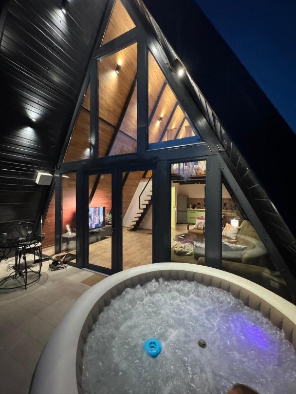 a hot tub in the attic of a house at Villa Natura in Bosanska Gradiška