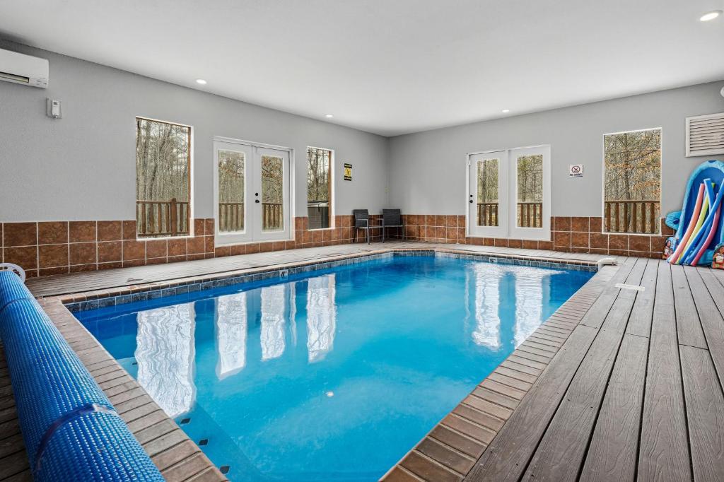 a swimming pool with blue water in a house at Apalachee Pool lodge in Cosby