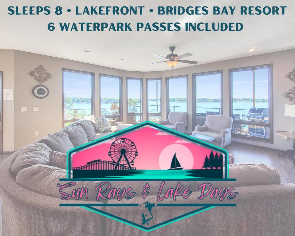 a living room with a couch with a sign that reads sun rays and take days at Bridges Bay Resort Brooklyn Building 308 in Arnolds Park