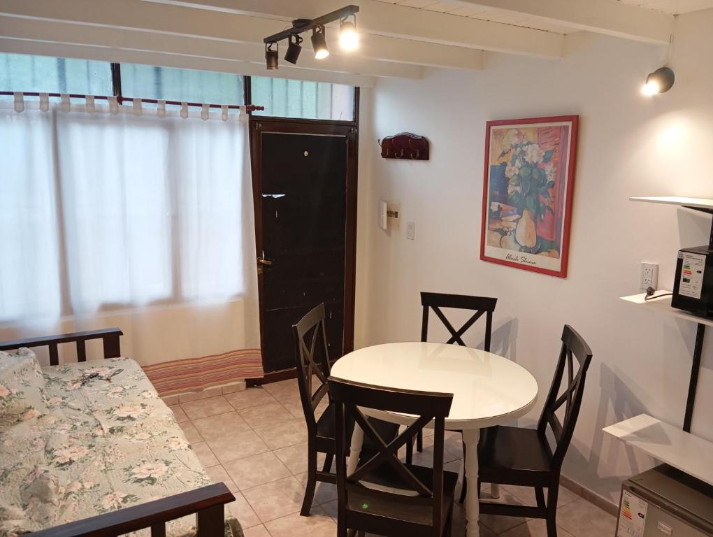a kitchen and dining room with a table and chairs at Panchitas in Guaymallen