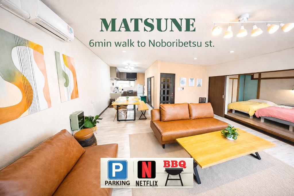 a living room with a couch and a bed at MATSUNE 松寧 6min walk to Noboribetsu st in Noboribetsu