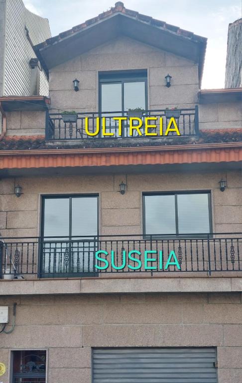 a sign on the side of a building at Ultreia in Arcade