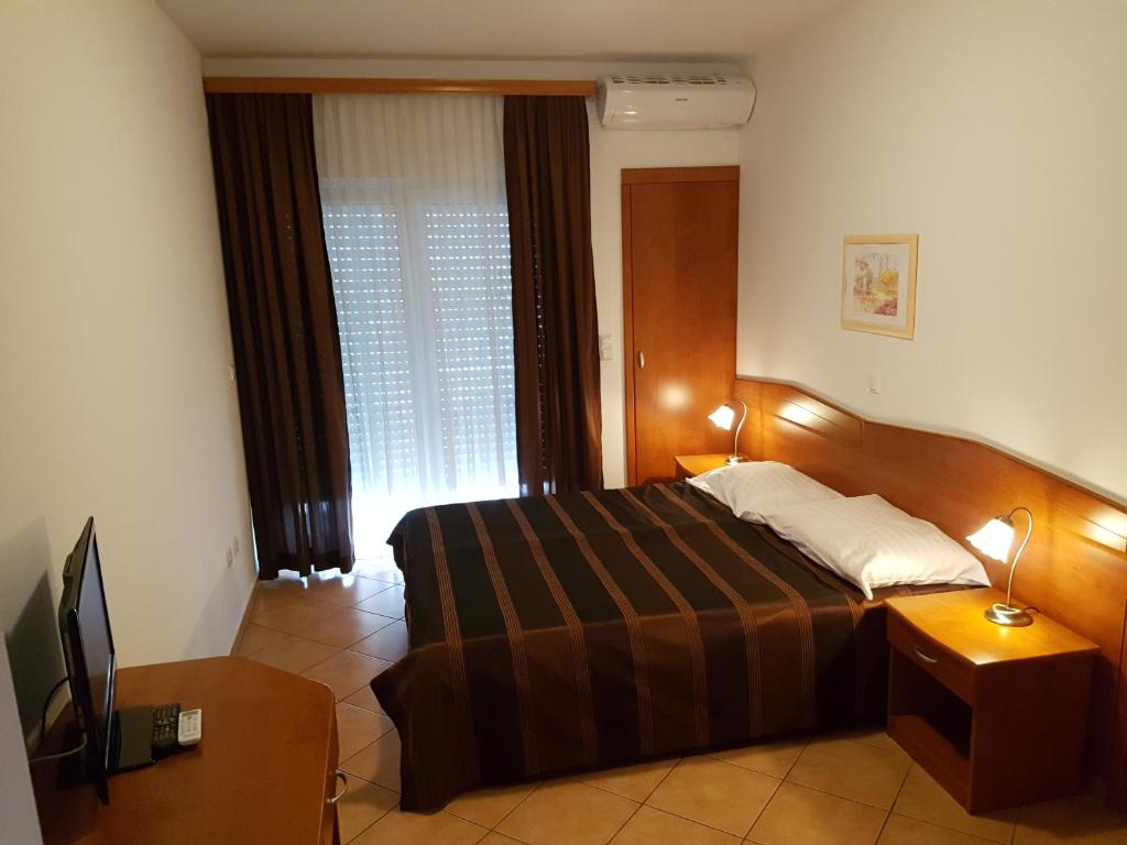 Postel nebo postele na pokoji v ubytování Guesthouse Villa Adria