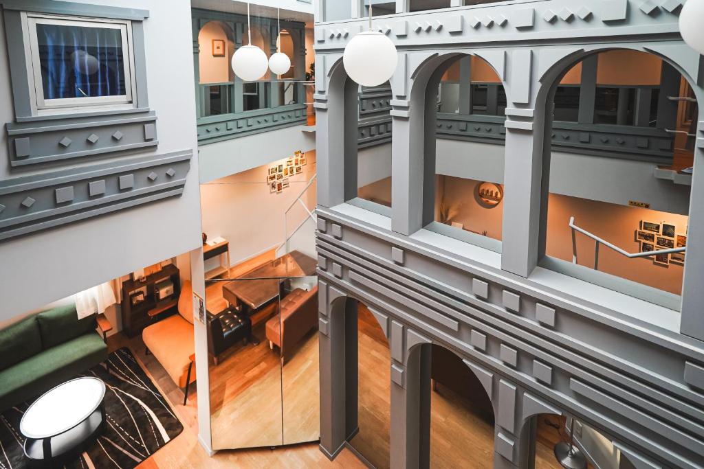 a rendering of the lobby of a building with a view of a room at HennaWatei in Osaka