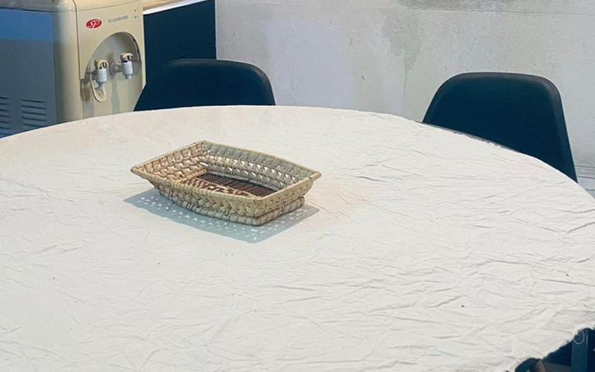 a wicker basket sitting on top of a table at La Casa de la Abuela in Paso de los Libres