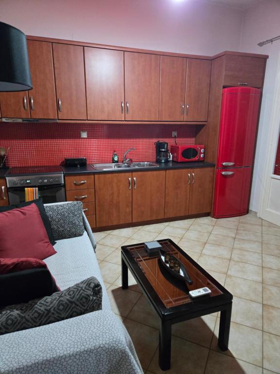 a living room with a couch and a coffee table at NK Dreamy Suite in Thiva