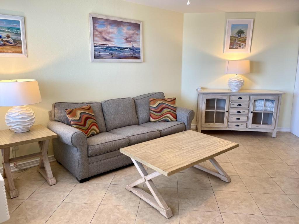 a living room with a couch and a table at Beachgate Condo Suites and Hotel 533 condo in Port Aransas