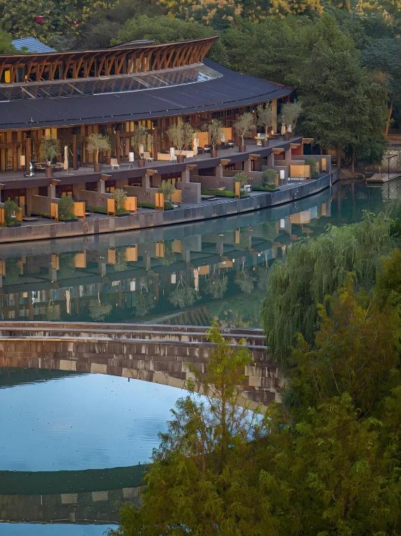 an aerial view of a building next to a river at XIN HOTEL in Hangzhou