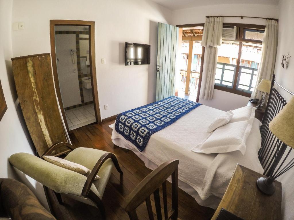 Postel nebo postele na pokoji v ubytování Pousada Rotunda