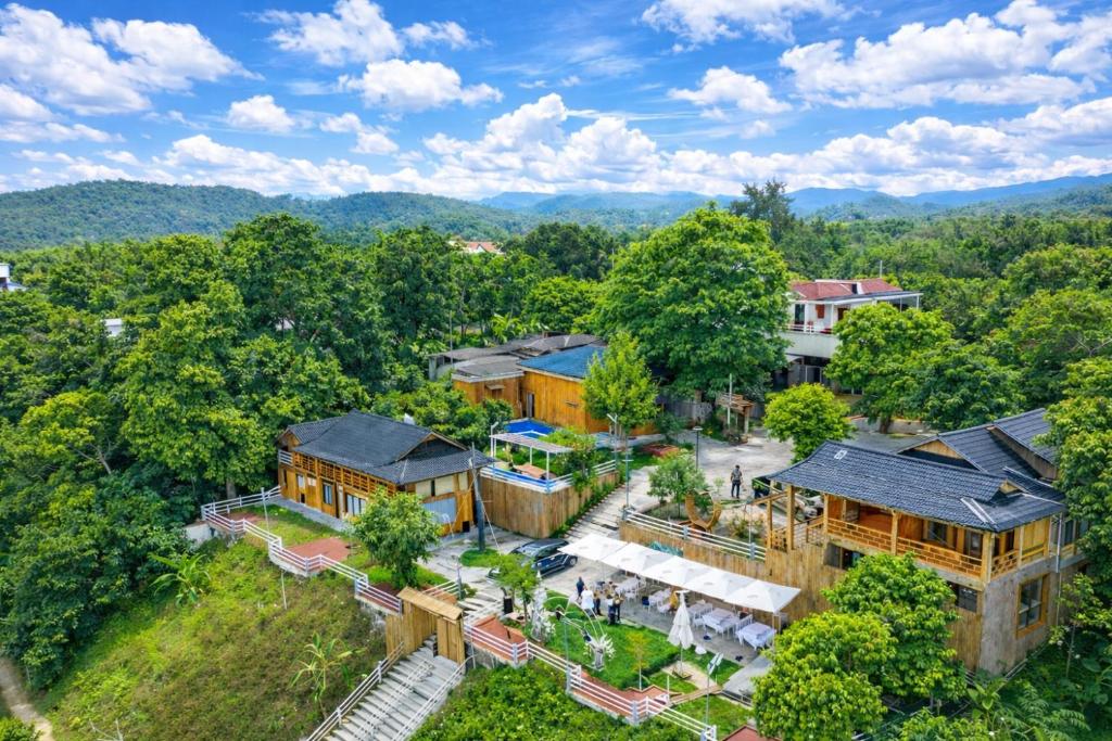 an overhead view of a building in the woods at Bon Ben Homestay in Hòa Bình