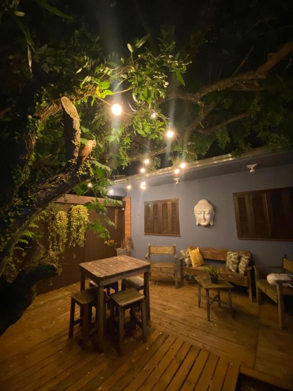 a living room with a table and a couch at Morada Héstia in Imbé