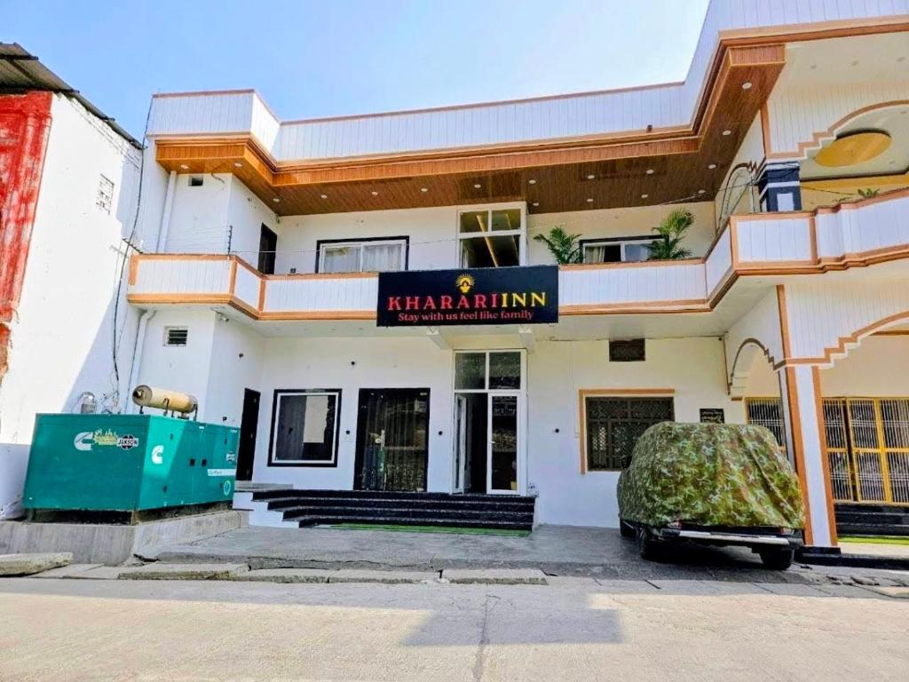 a building with a sign on the front of it at Kharari Inn in Ayodhya