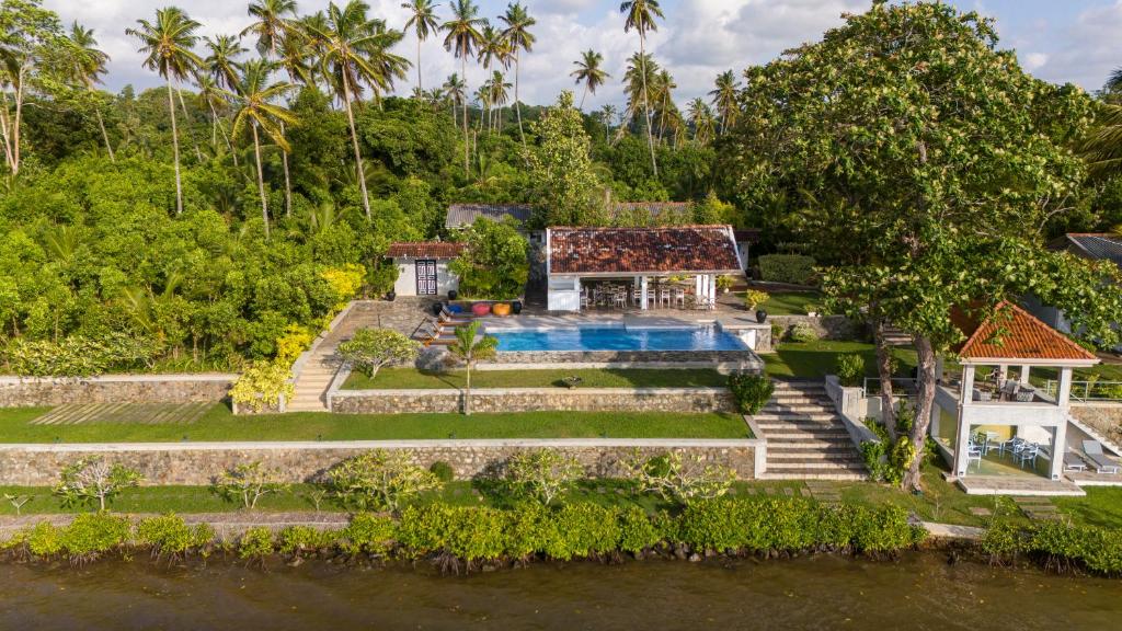 an aerial view of a house with a swimming pool at The Niche Hikkaduwa - 10 minutes to the beach in Hikkaduwa