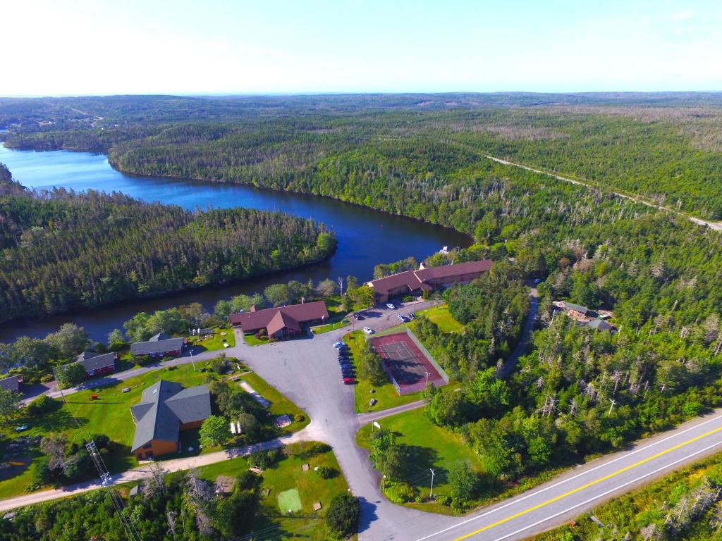 an aerial view of a house next to a river at Liscombe Lodge Resort & Conference Center in Liscomb