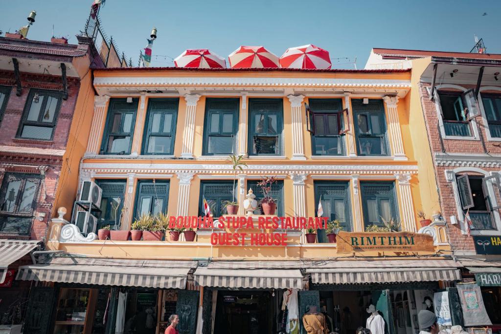 a building with a sign on the front of it at Boudha Stupa View Guest House in Kathmandu