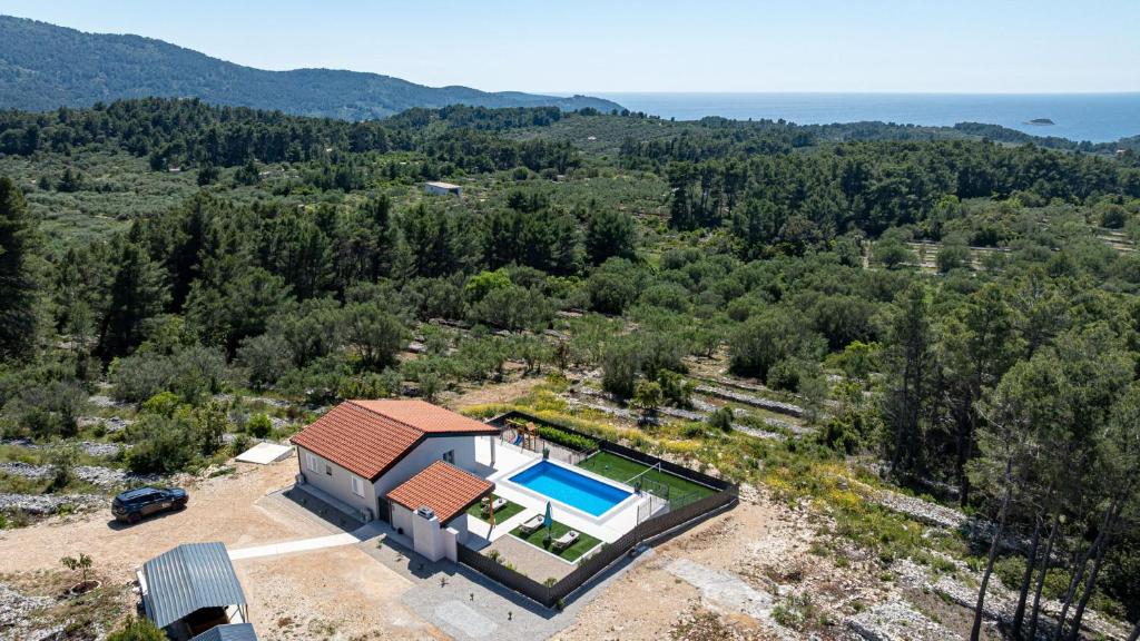 an aerial view of a house with a swimming pool at Villa Antea by Villas Guide in Vela Luka
