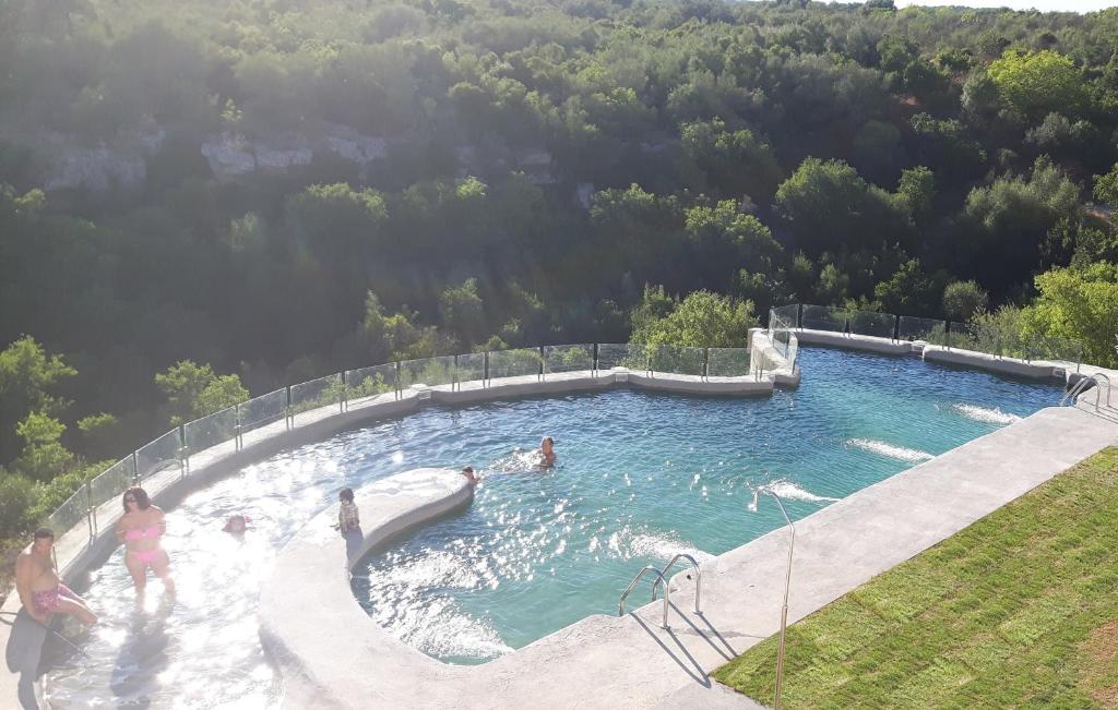 a group of people in a swimming pool at Centro de Naturaleza Cañada Verde "el Parque de Naturaleza con mas experiencias de Andalucía" in Hornachuelos