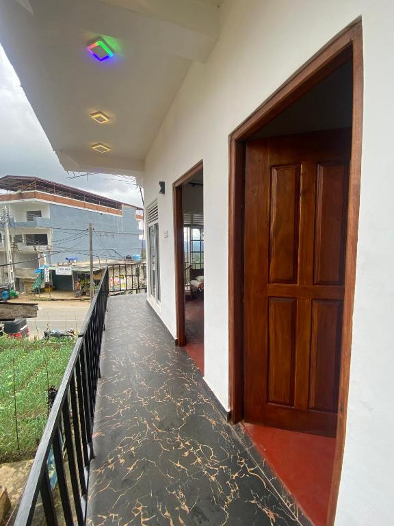 a door on a house with a balcony at Budget Comfort Villas in Boragasketiya