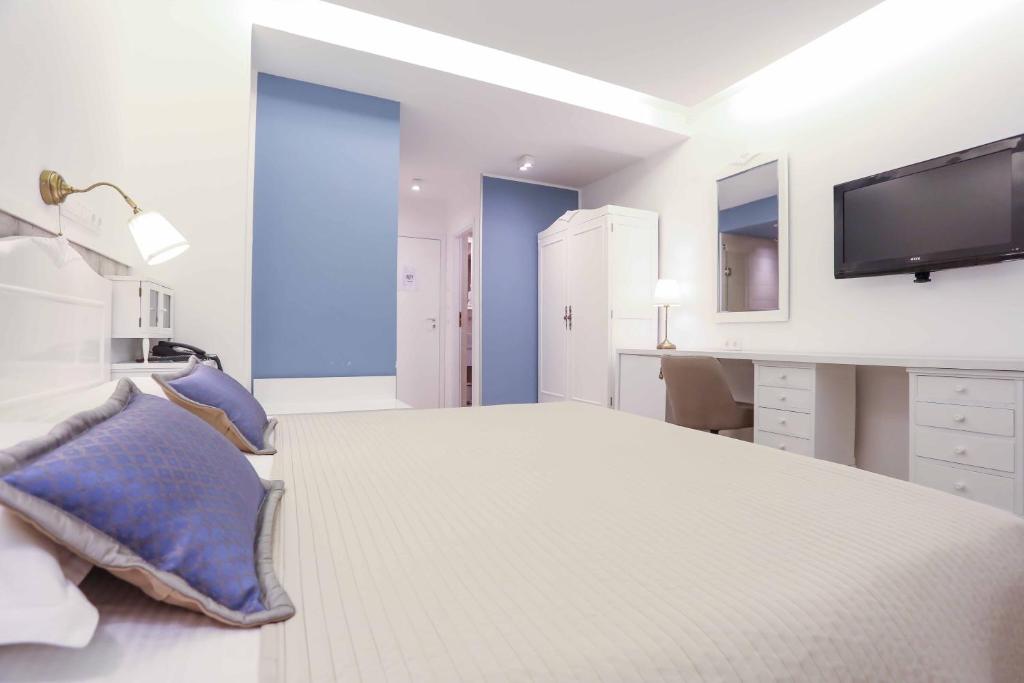 Postel nebo postele na pokoji v ubytování Hotel Divan