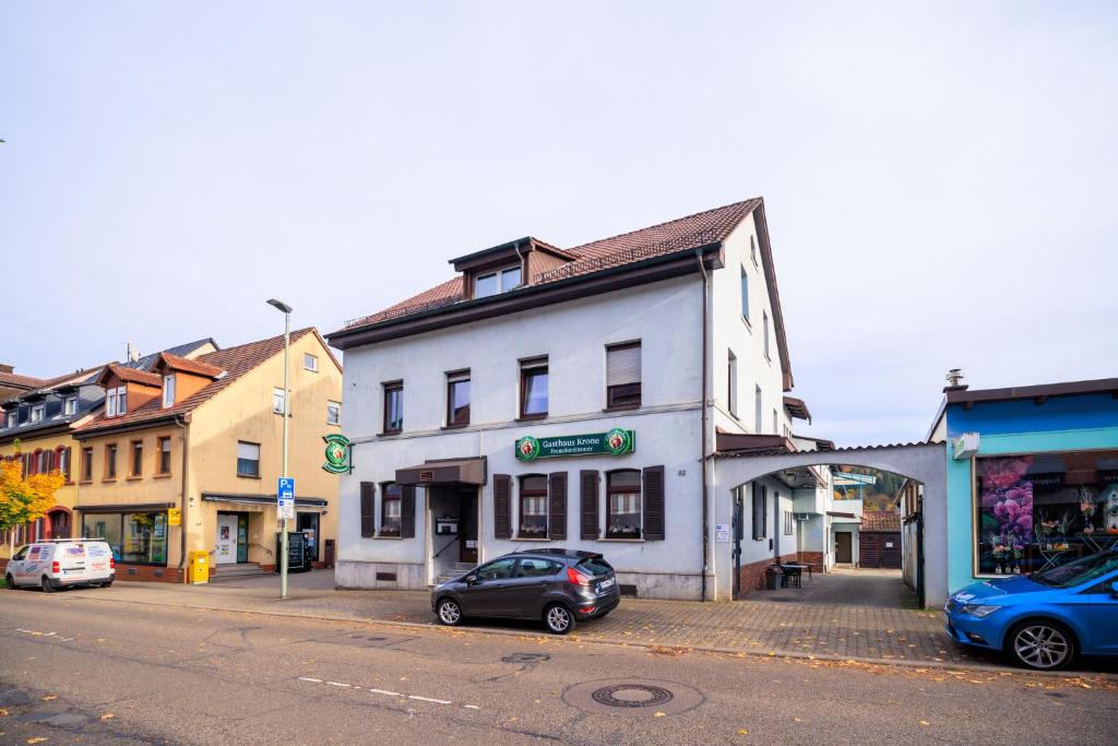 a white building on the side of a street at Gasthaus Krone in Pforzheim