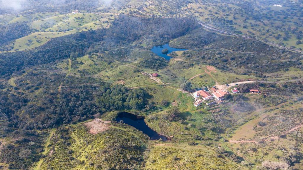 an aerial view of a mountain with a house on it at Quinta Marugo Retreats in Serpa